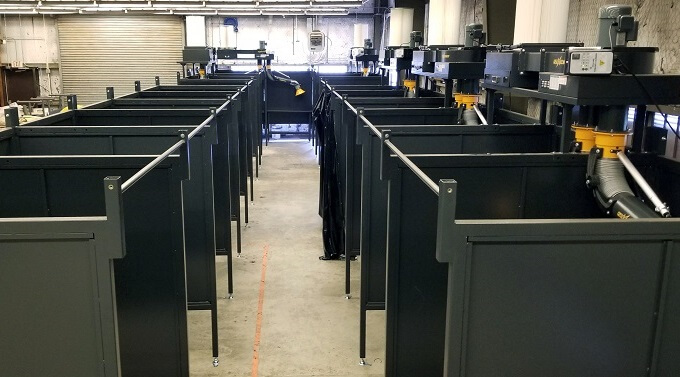 FumeXtractors welding booths and fume extraction arms installed in a highschool welding workshop to remove fumes and smoke.