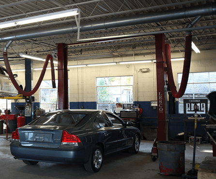 Fume-A-Vent simple drop systems show in an auto dealership installation.